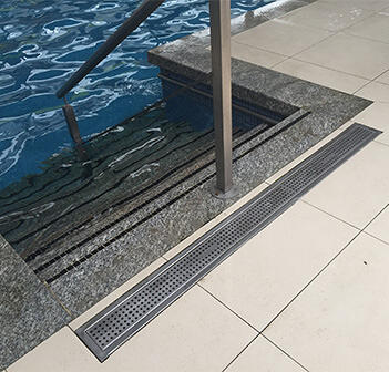 Kent's drain gratings outside a swimming pool